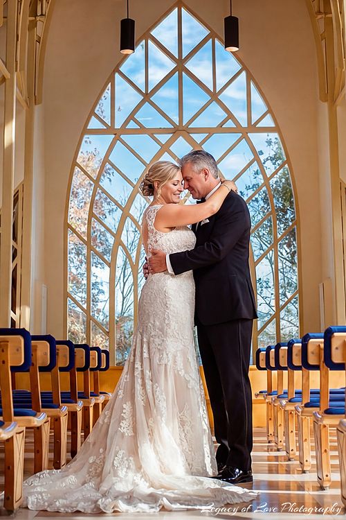 A mature bride and groom embracing closely and smiling during their elegant second marriage celebration in Florida.