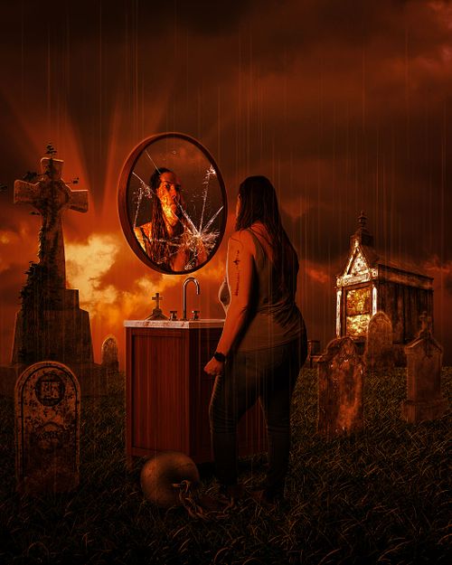 A rusty scene of a woman looking at herself in vanity amongst gravestones dragging a ball and chain.