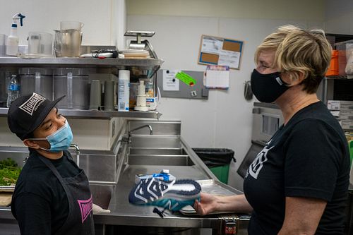 Group interaction at Homeboy Industries during the pandemic — photojournalism by David Andrade, Los Angeles