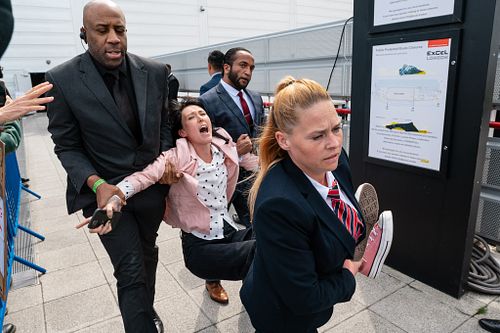 Climate campaigners from Fossil Free London protest the 2023 Shell AGM at London's Excel Centre, London, UK