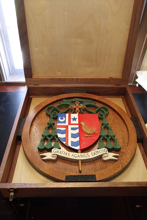 custom shipping crate for hand carved and painted coat of arms for Catholic Bishop