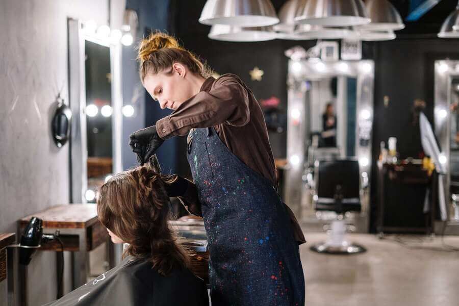 Hairstylist working on a model