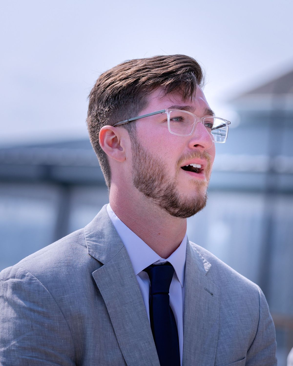 emotional groom watching his bride coming down the stairs at the hyatt in dewey beach
