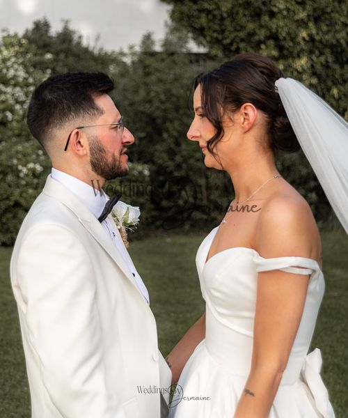 Wedding by Jermaine – bride and groom facing each other on the beautiful grounds of the venue