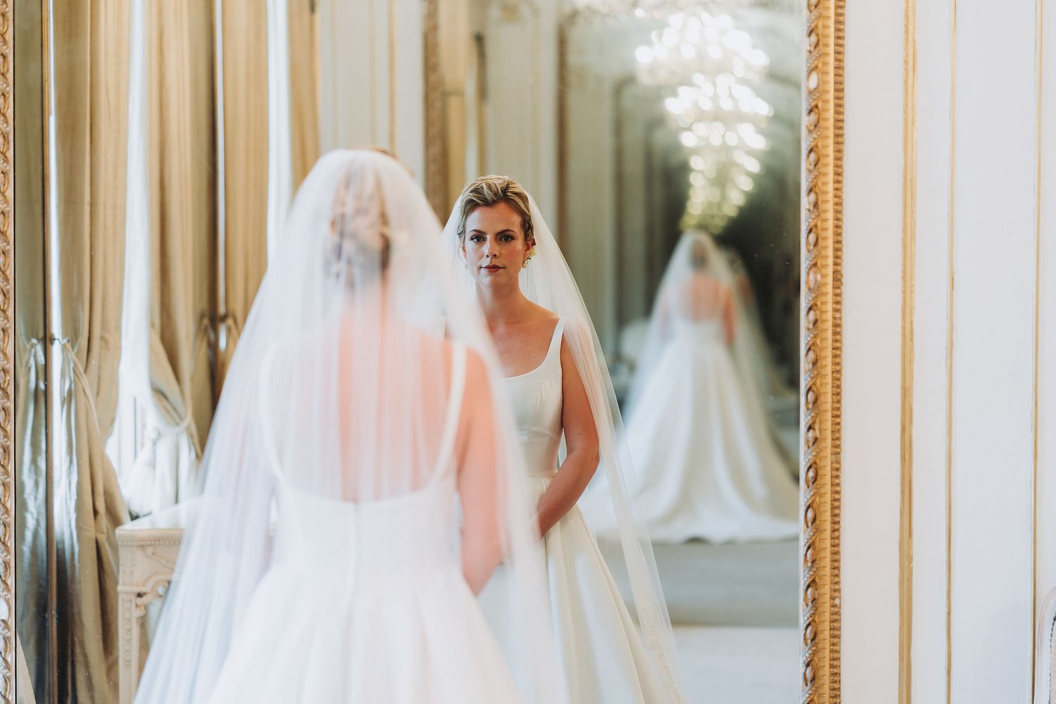Bride looking in mirror
