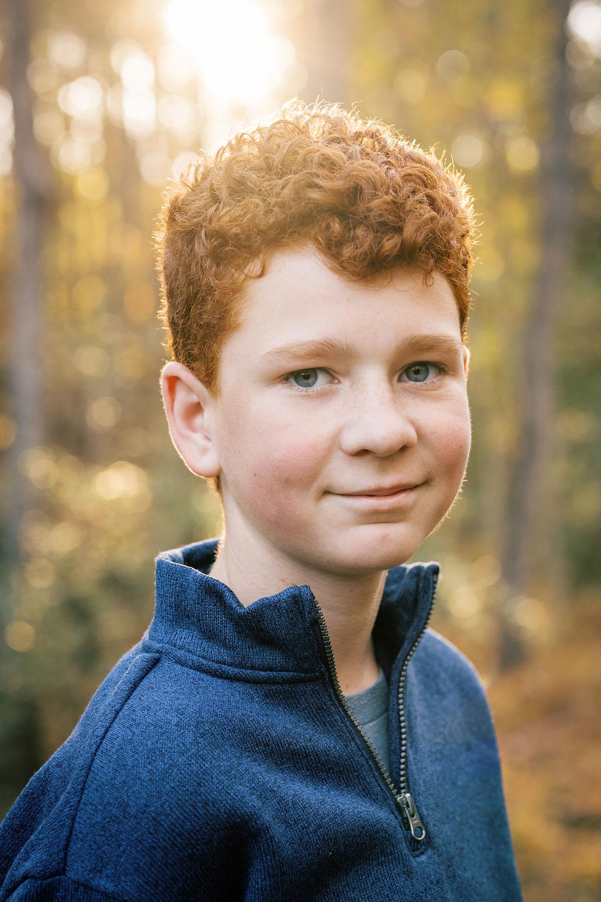 A young man photographed at Golden Hour in Carolina North Forest in Carrboro, NC