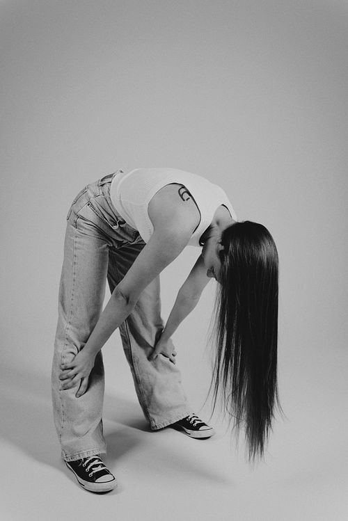Black and white portrait of a woman in Poznań, focusing on light, contrast and emotion