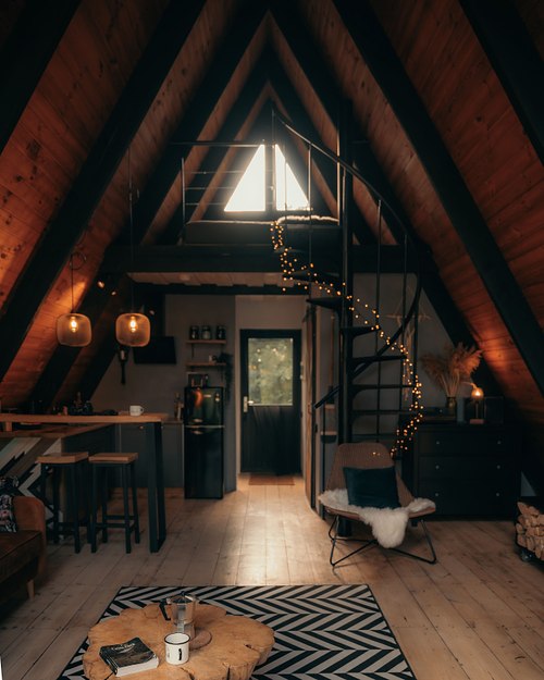Cozy wooden cabin interior with warm light and modern design