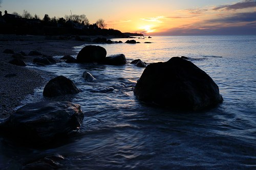picture of Long Island Sound and coastline at sunset.