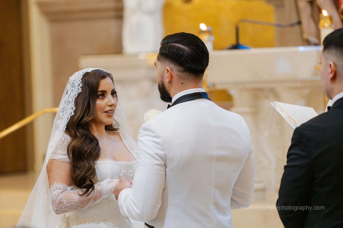 Exchanging vows at Saint Joseph, Husband of Mary Roman Catholic Church in Las Vegas Wedding Photography