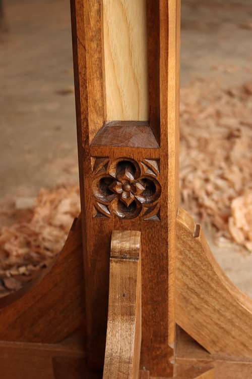 detail of the quatrefoil at the bottom of the arch on the dominican sisters' lectern with flower carving