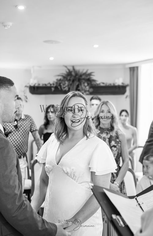 Bride-and-groom-listening-to-officiant-at-Oakham-Registry-Office