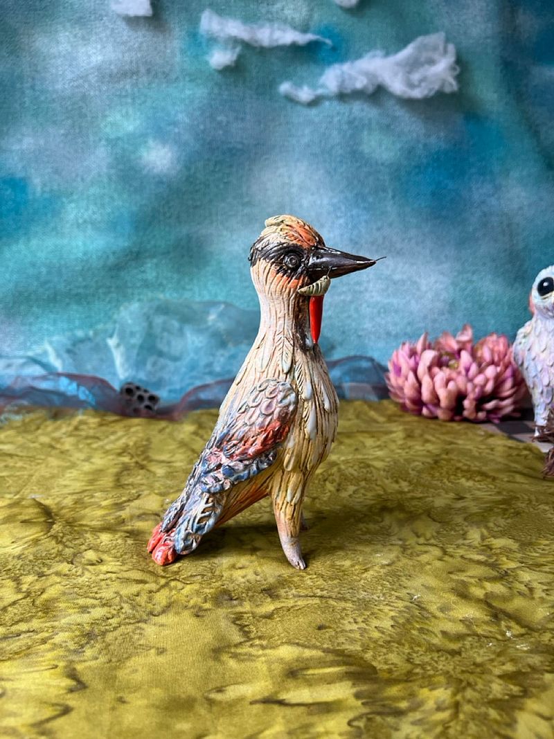 Woodpecker with a prey