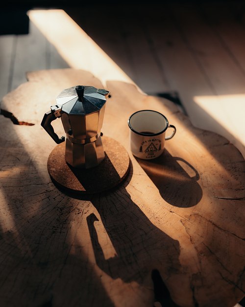 Morning coffee detail inside Two Black Cabins in Latvia