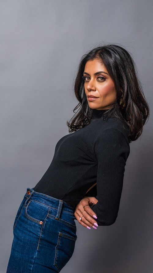 Candid studio portrait of Umangi laughing under softbox and strobe lighting — lifestyle portrait by David Andrade, Los Angeles
