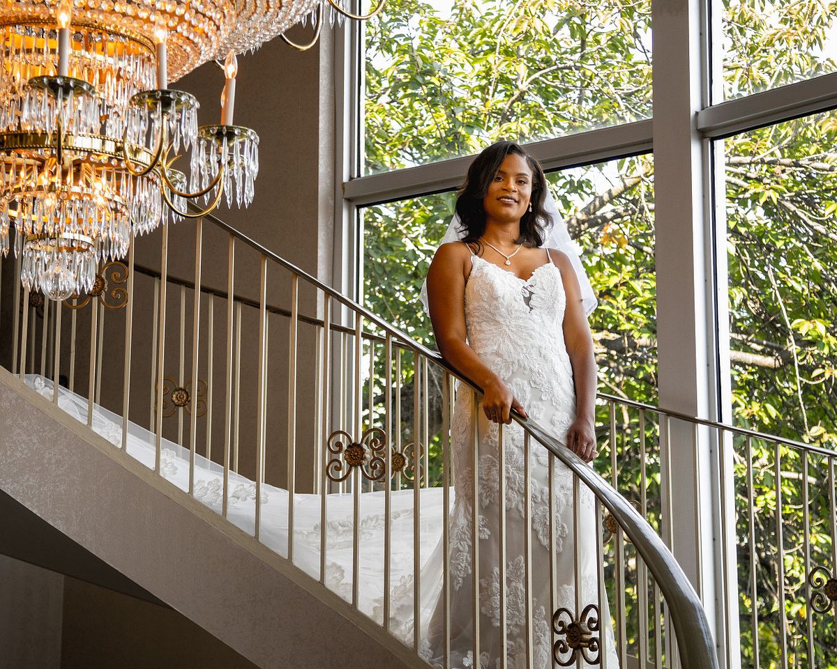 bride descending spiral staircase at Martin's Catering, Westminster, MD