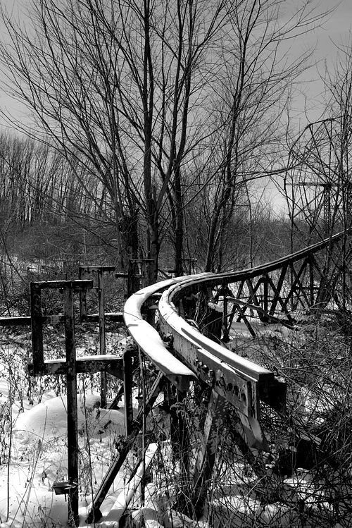7 foot photographer, workshop tour in US, United States, black & white, b&w, abandoned roller coaster at amusement park