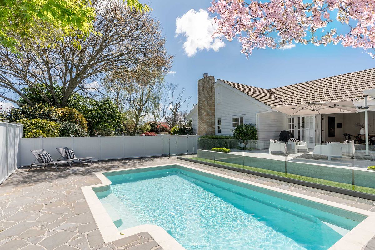 Luxury residential photography featuring an outdoor pool and modern build in East Hamilton by Flax Cove Studio.