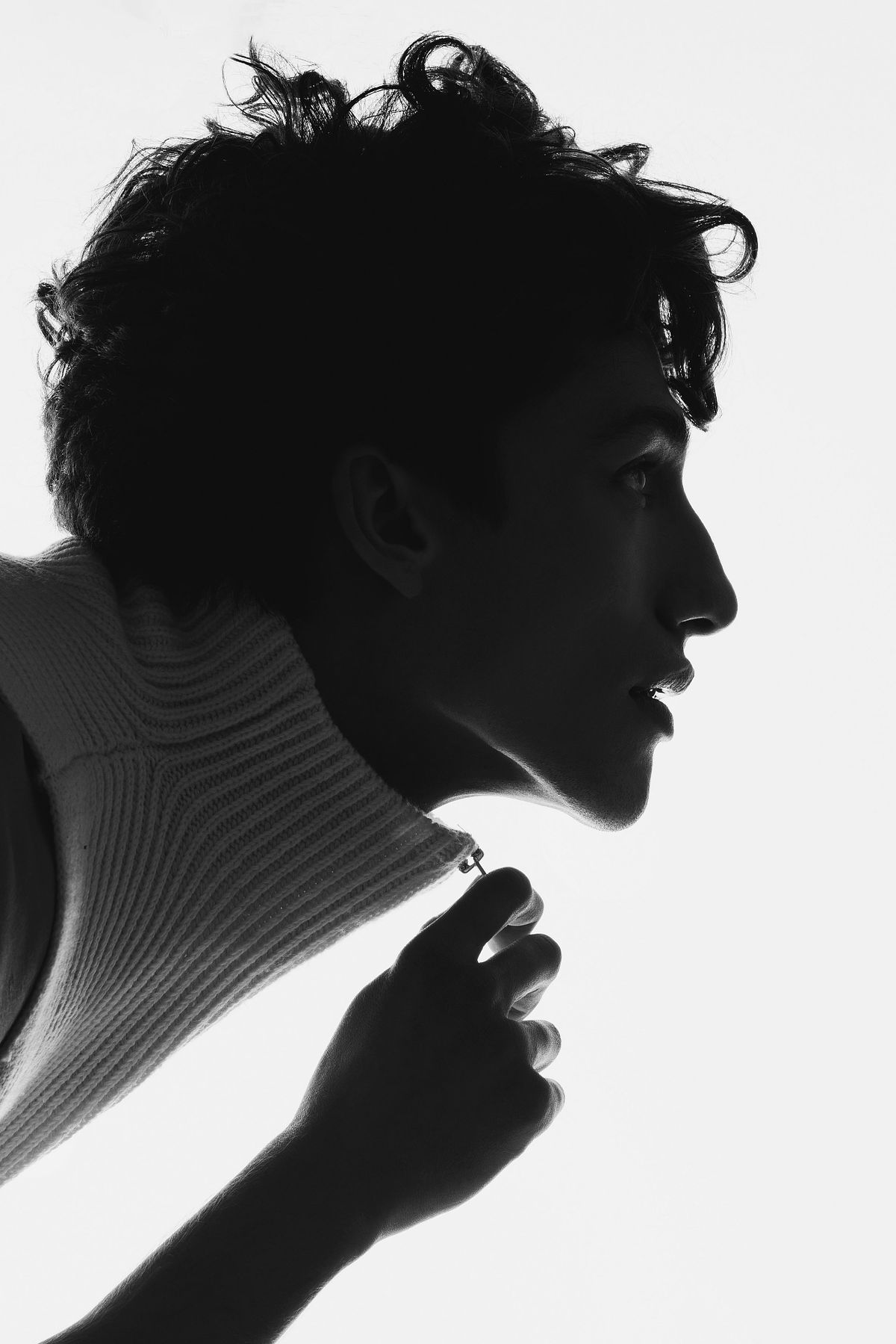 Black and white photography with backlight studio light featuring a male model. Photographed by Filianna Karamanli.