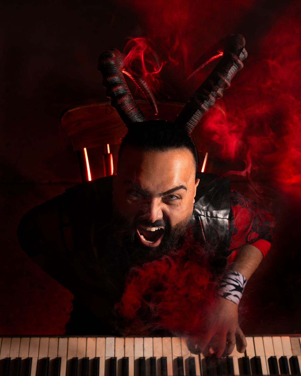 The Devil playing piano in a room of smoke.