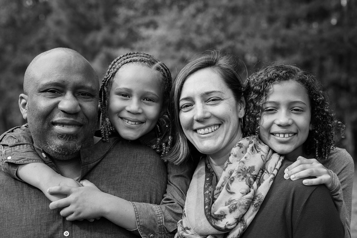 Black and white photo of a family in Dr. Martin Luther King Jr. Park in Carrboro, NC