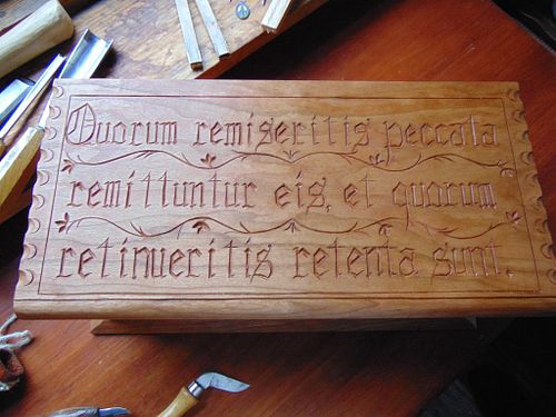 letter carving on the lid of another one of the carved cherry boxes