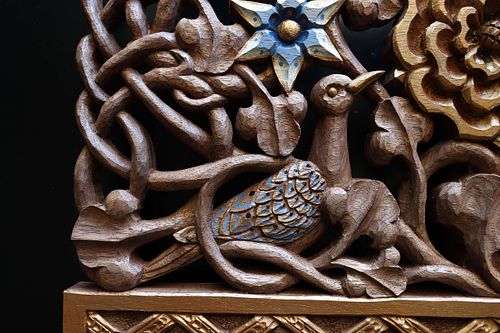 close view of hand-carved and painted turtle dove for the tabernacle crown at St. Bernadette Catholic Church