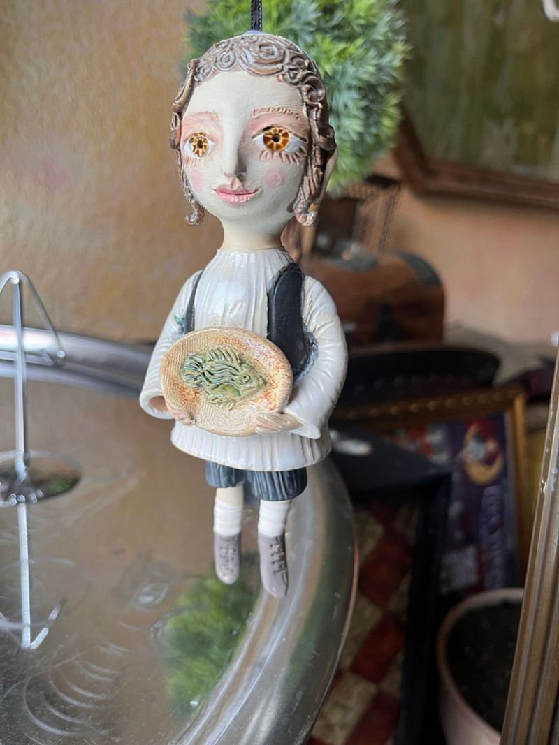 Traditional boy with a fish, little ceramic hanging sculpture
