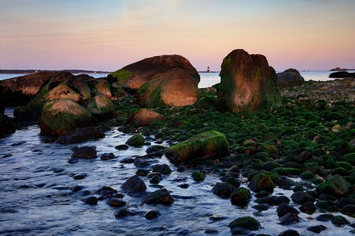 Orient Point Lighthouse beyond the Rocks.