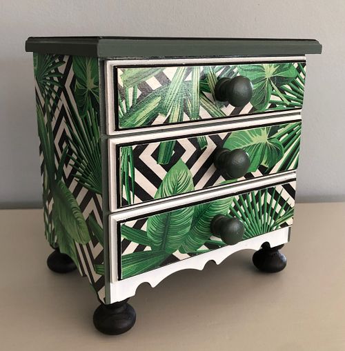 Decorative drawer with tropical leaf pattern and geometric design, perfect for modern home decor.