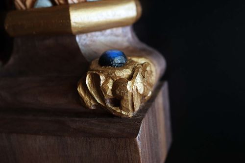 detail of spur of swirling vines and a blue bead on the column base for the tabernacle at St. Bernadette Catholic Church in Lancaster, Ohio
