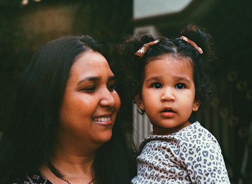 Indian mother smiling at her child