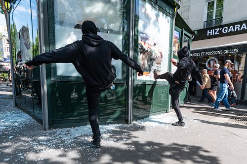 French police clash with May Day protesters as tens of thousands march in Paris, France.