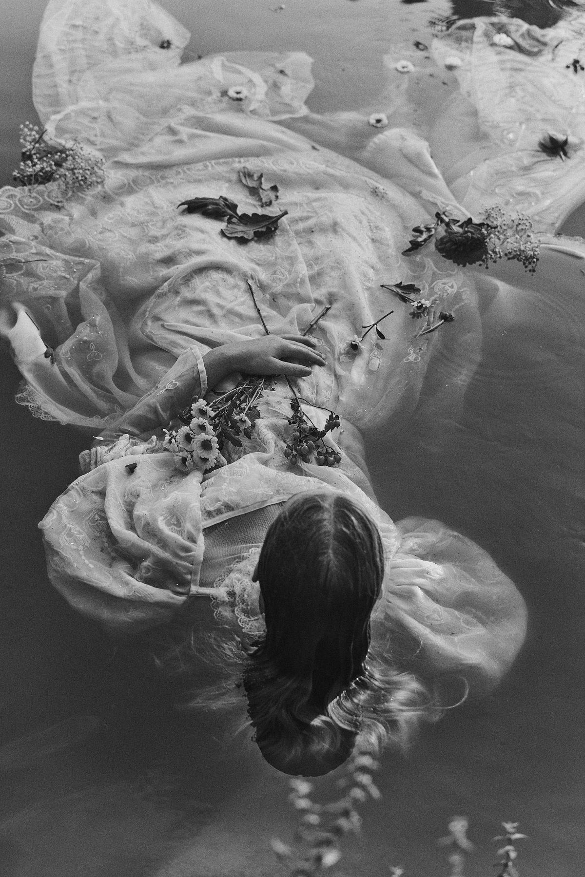 Re interpretation of Ophelia drowning in a pond full of flowers, melancholic and poetic interpretation of Sir Everett Millais Ophelia shot by Gabriel Matula.