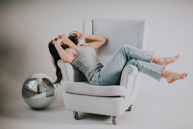 woman sitting on sofa chair