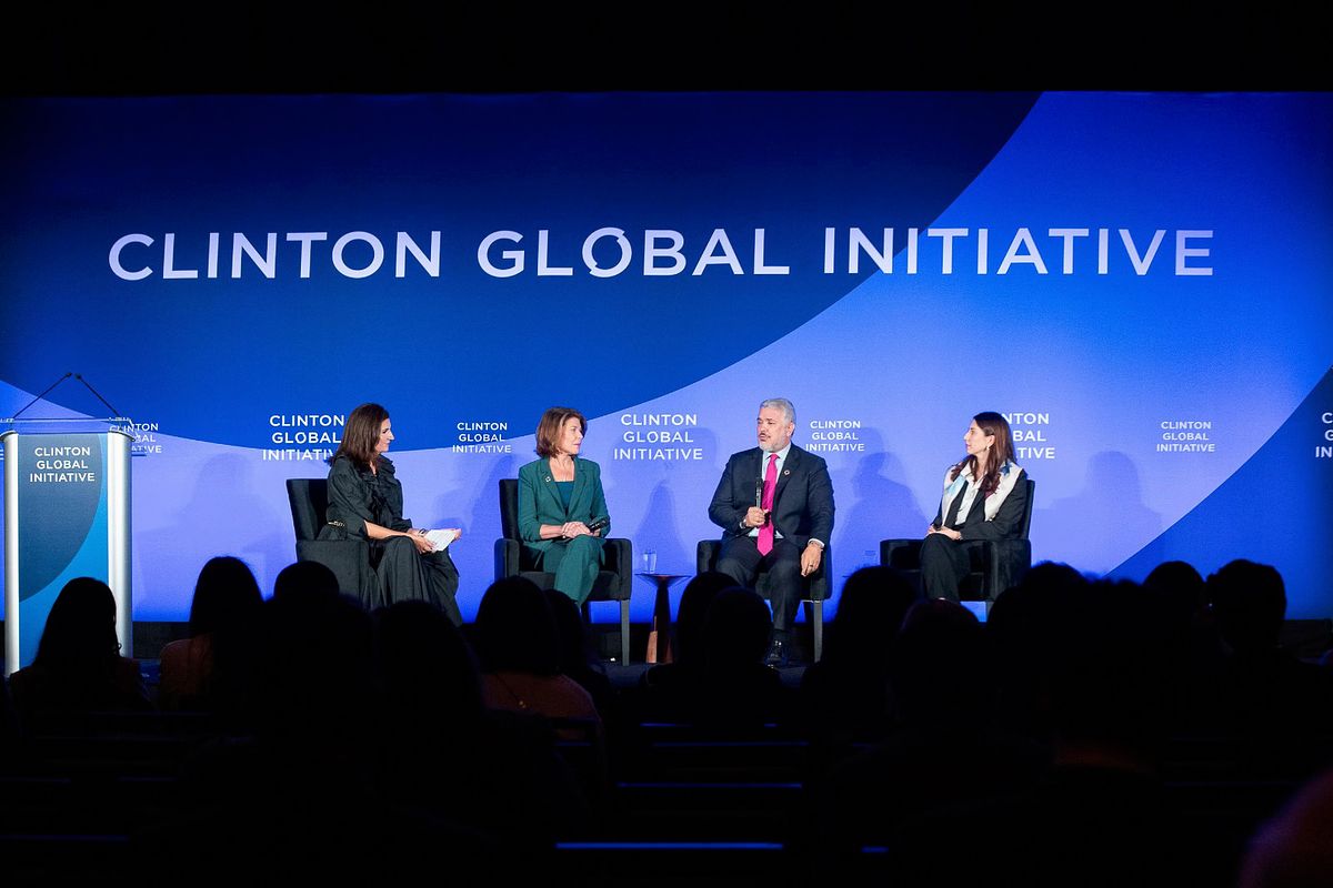 Corporate event photography capturing panelists on stage during the “Bridging Digital Divides” session at the Clinton Global Initiative 2024 Annual Meeting in New York City, emphasizing leadership dialogue, connection, and equity in technology access.