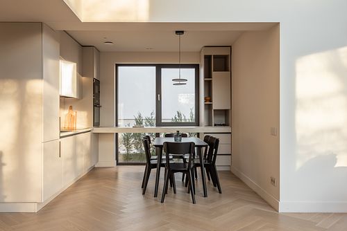 Kitchen design bathed in warm afternoon light, creating a cozy atmosphere – Faget project
