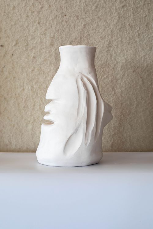 Hand-built stoneware with matte glaze, exploring the immaterial forces between two flower blooms.