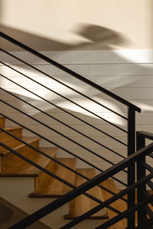 Shadow action shot of flat bar railing and stair