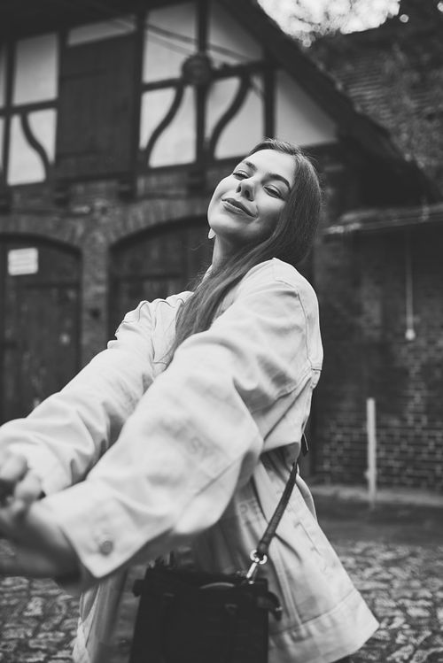 Cinematic portrait of a girl in Jeżyce, Poznań, minimal composition and natural expression