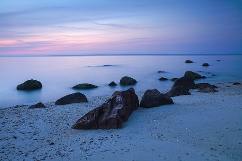 Cerulean sky and sea at dusk.