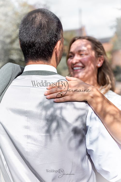 Bride-and-groom-listening-to-officiant-at-Oakham-Registry-Office