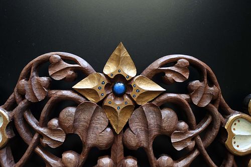 hand carved and painted virgin's bower flower on tabernacle crown with scrolling vines all in walnut
