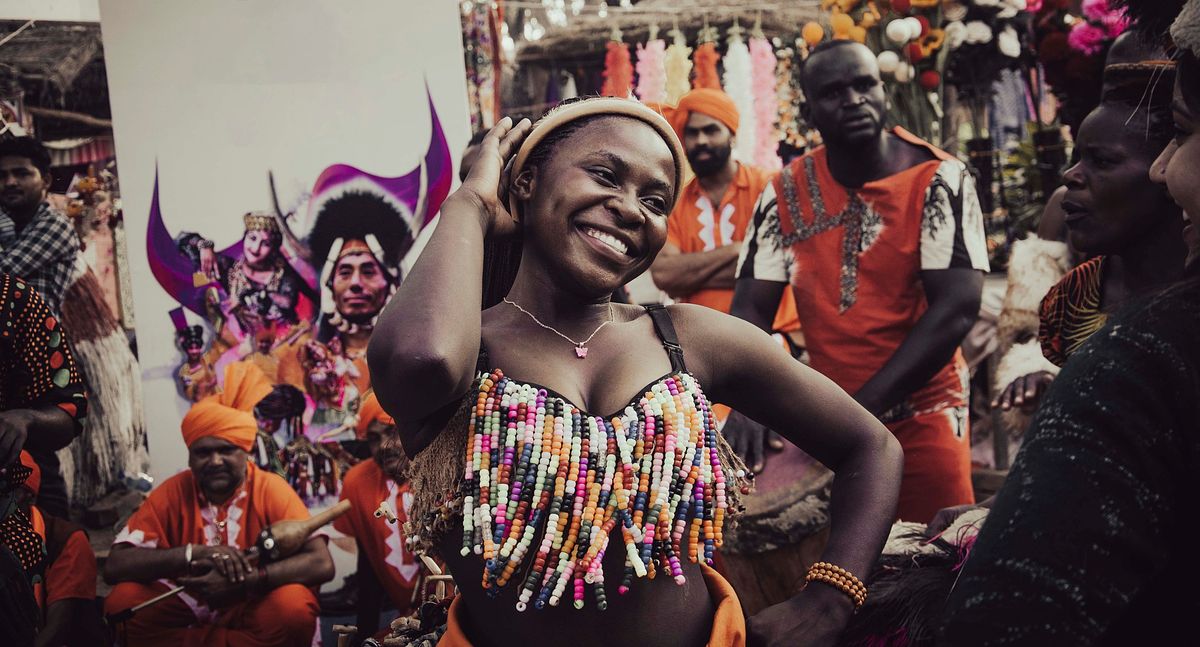 celebration, woman, tribal woman, dancing woman, face expression, smiling , crowd, people