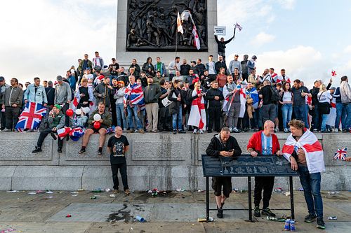 Protesters climb Trafalgar Square plinth during “Unite the Kingdom” rally, London, UK
