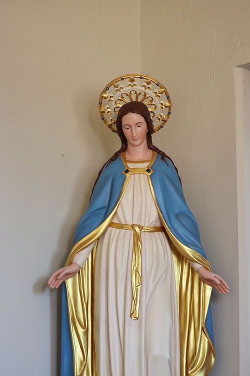 The restored statue of Mary with her new halo at Holy Trinity Catholic Church