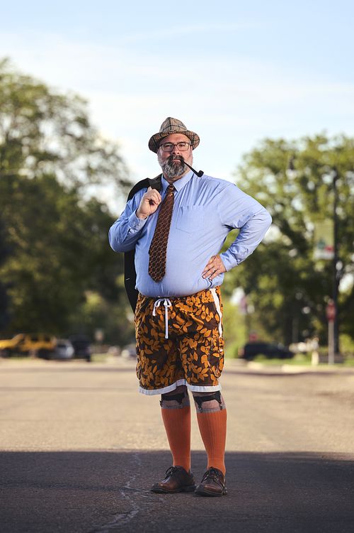 Portrait of man in street, uniques styling.