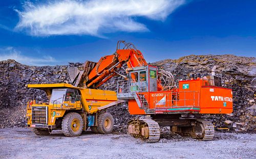 Crushing cement stone and transporting, Showcasing loading cement
