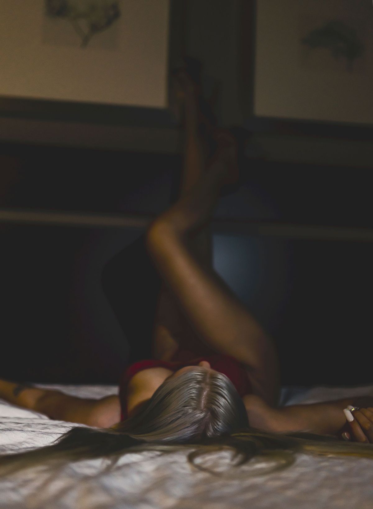 Empowering boudoir portrait with confident pose and soft lighting