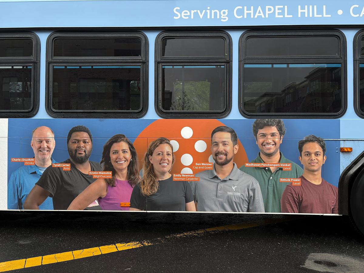 A Chapel Hill Transit bus ad featuring a composite photo of entrepreneur's from Innovate Carolina